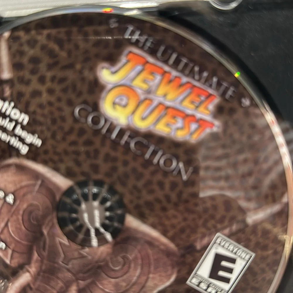 Used iWin The Ultimate Jewel Quest Collection CD-ROM Game. Rated E